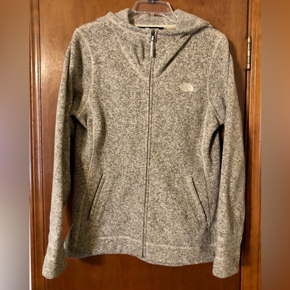 The North Face Fleece full zip Oatmeal colored sweater with hood.